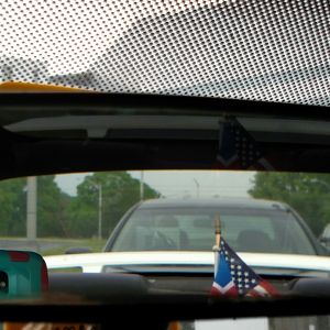 look at the driver behind me! Can you believe it, he's reading a newspaper while driving.