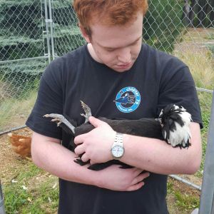 My wonderful step son mike with hi little girl named sponge bob square pants, his first chicken at the age of 18