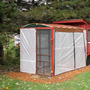 arched tarp roof and covered sides for winter, I plan on install a metal roof over the run this coming spring