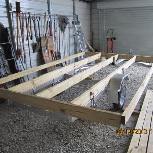 Building the foundation for the floor out of 3 2x6's and two 2x4's for the fore and aft and two 2x6 front and rear cross memebers.