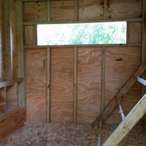 Inside. "Window" is screened and can be closed as needed. We live in the south so this level of ventilation is needed in the summer.