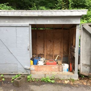 This is the shed we originally planned to use for the coop... but after digging the old owners crap out of it we found it to be falling apart and not really functional for our purposes.  It got torn down and the new coop built on the same location.