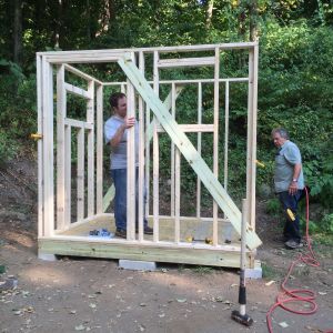 DH helping get the walls up