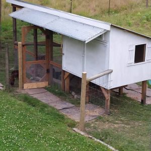 I added a fence post and move the fence so we can access the coop doors without actually entering the chicken pasture.