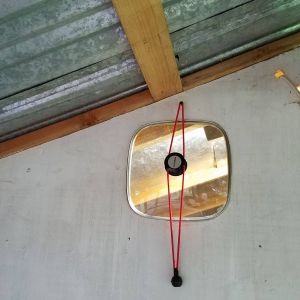 Saw this on another member's coop, awesome idea! This is right next to the light we have in the coop and illuminates the enclosed run in the early winter mornings.