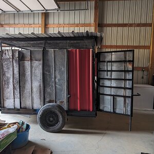 Chicken trailer in brooder mode, in our shop building ready for chicks