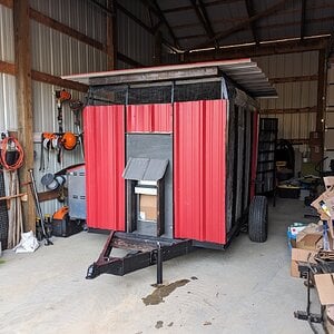Chicken trailer in brooder mode, in our shop building ready for chicks