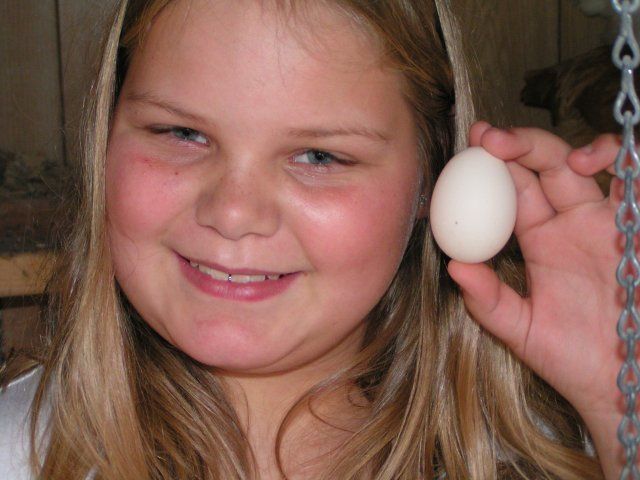 13294_erica_holding_first_egg_11-9-08.jpg