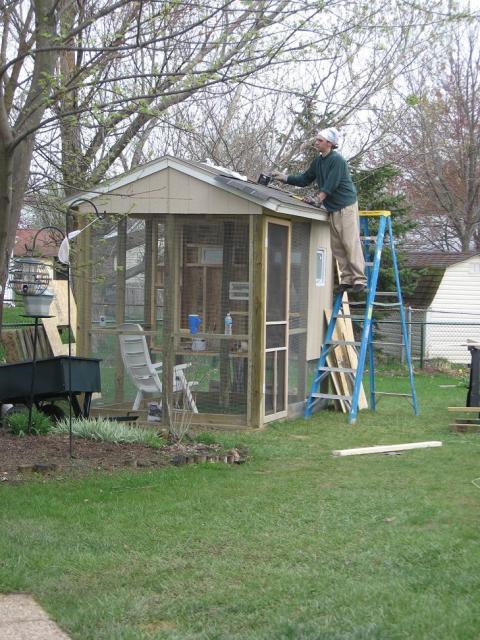 50123_4-05_putting_shingles_on_the_roof.jpg
