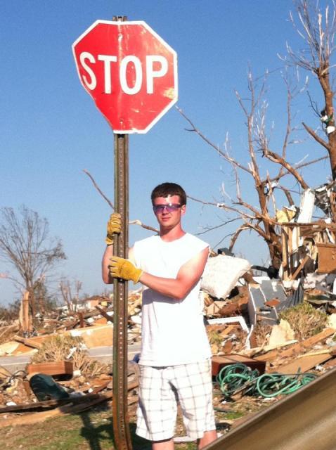 9192_stefan_with_stop_sign_cleaning_up_joplin_mo.jpg