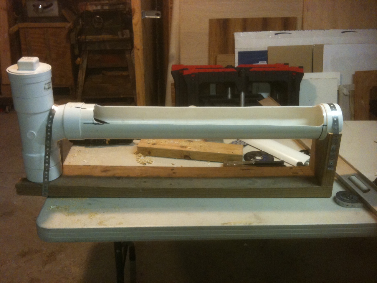 12. I failed to get pictures of the bottom and cradle as I was building this but it's really pretty simple. I just notched out 1¾" for the bottom of fill valve and screwed the cradle to the other end. It is held in place with plumbing strap. You can get a fitting at HD or Lowes to adapt the  toilet supply line to an outside spigot. Hook it up to a water supply.  How often you'll have to clean it depends on the number of chickens using it.