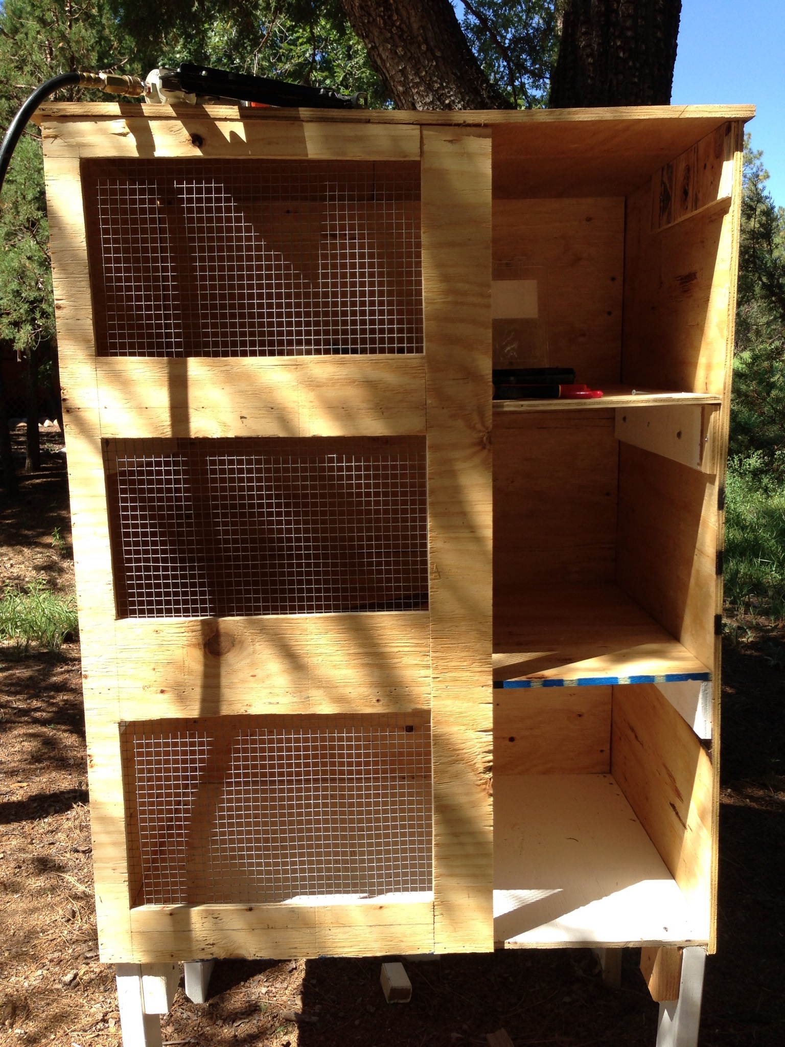 2 ft section on the left side was cut out & enclosed with 1/2"x1/2" hardware cloth & 24" doirs per level on the opposite side