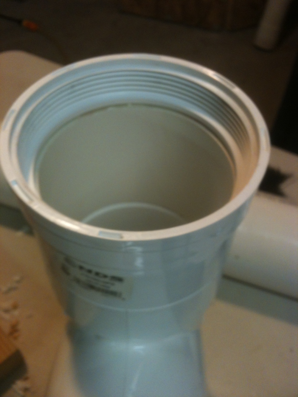 2. Glue clean-out fitting top of tee.