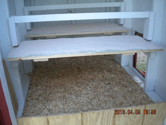 2 roosting bars and poop boards with sweet PDZ  and bedding.
