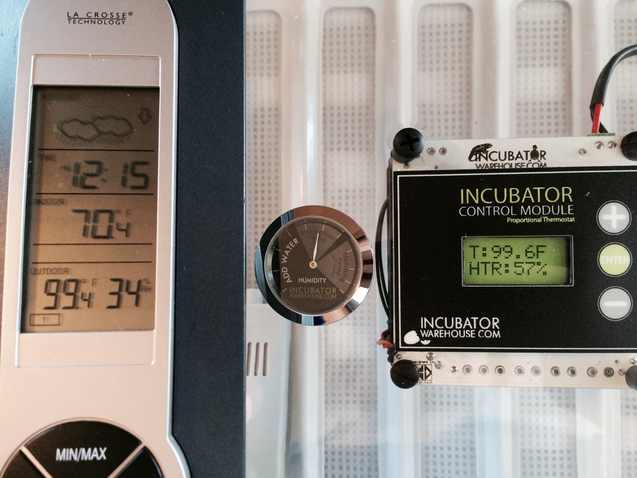 2h 16m since it was plugged in.
Time 12:15pm
My added sensor that sits in the tray is now reading nearly the same as the display readout. I figure it is only a fraction lower because it sits lower in the tray than the probe that comes down from the motor/display. My humidity reading shows 34% and the arrow on the humidistat on the  incubator lid is right in the middle of the "Incubation Period" block.
Temperature in my house, in this room, hovers around 67-70f and humidity is around 20-23%.