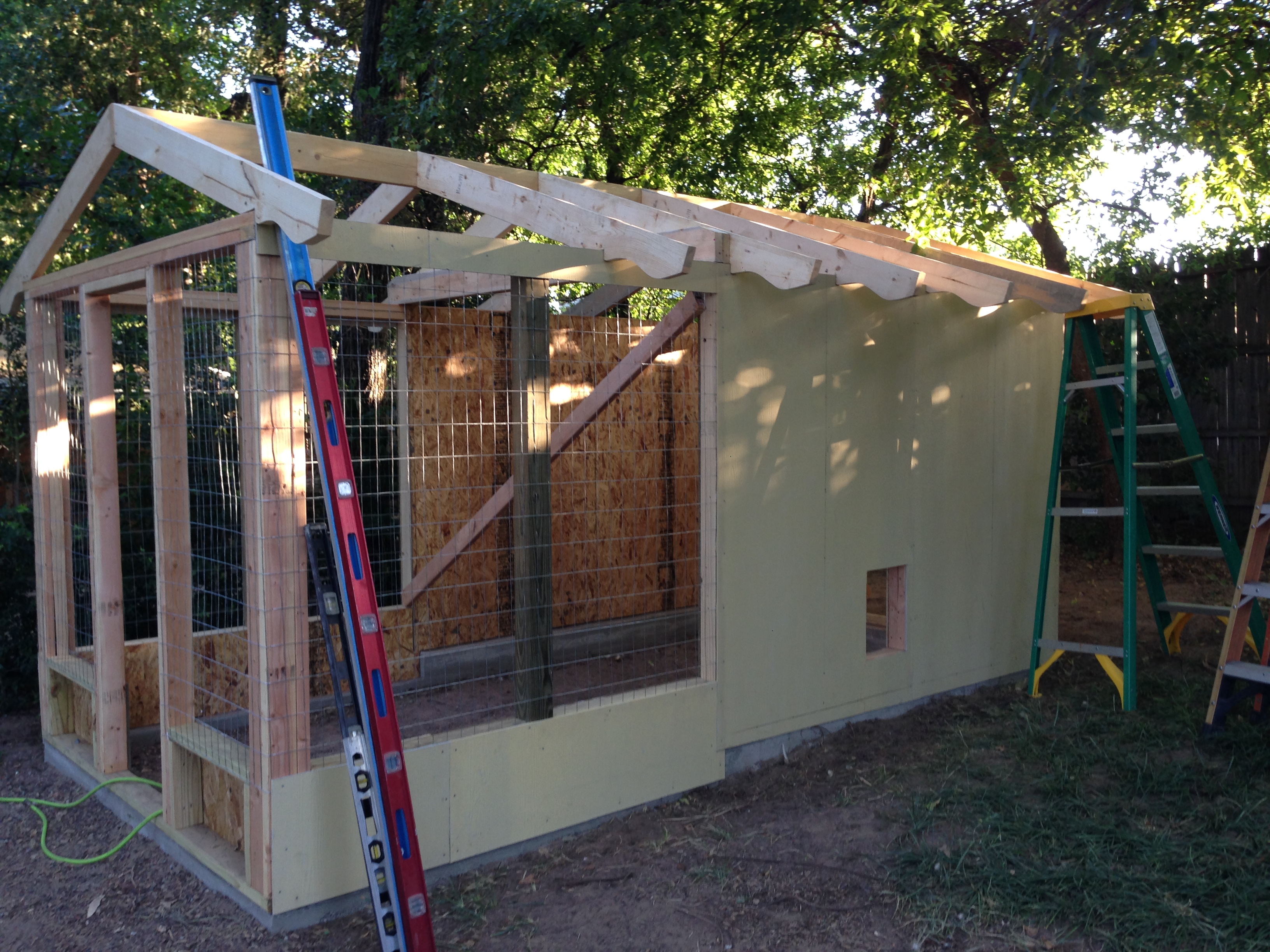 7/18/15.  Putting up exterior walls (concrete board) and look at the decorative eaves.