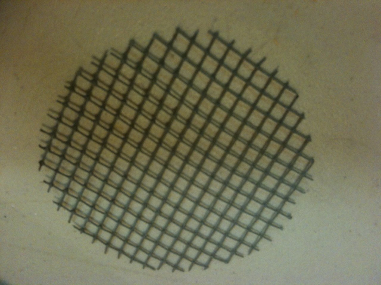 8. Cut hardware cloth circle. (place a piece of pipe on it and trace around it. Proper fit is important.