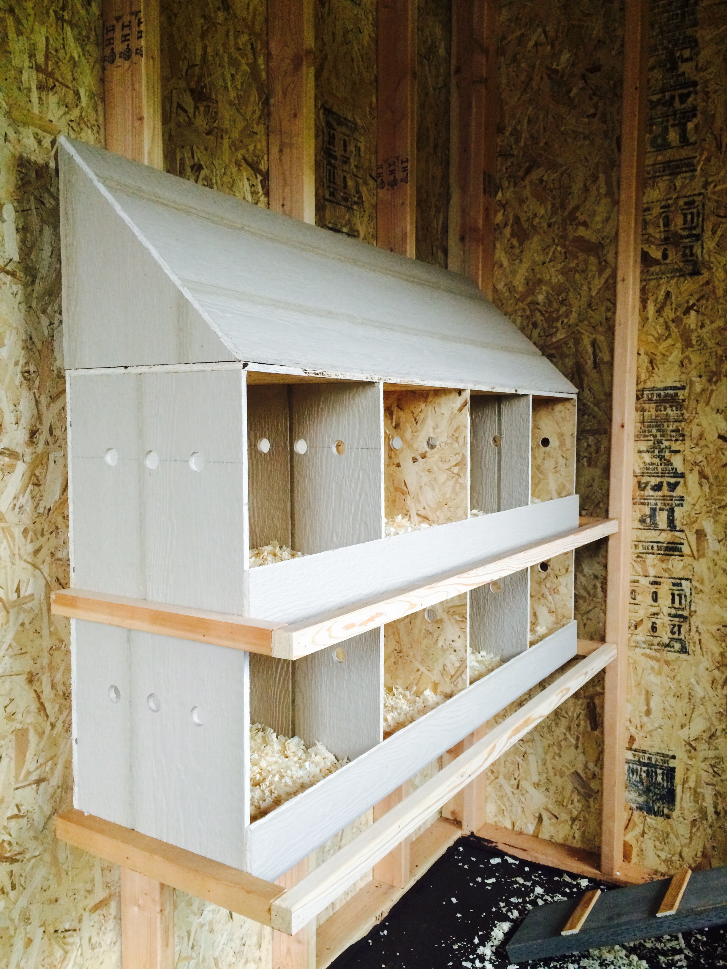 8 nesting boxes measuring 12"x12". Notice the vent holes, very important.