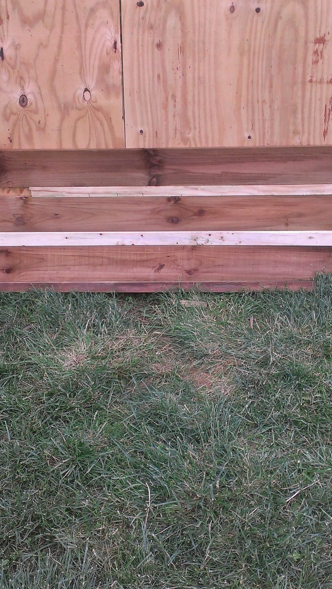 A close up of the fence panels. The light colored wood is just some 1x's used to give the appearance of cabin chinking. I will use 1x3's for that part. I will paint those boards the same color as my chinking on my cabin. I will post more updates as the transformation progresses.