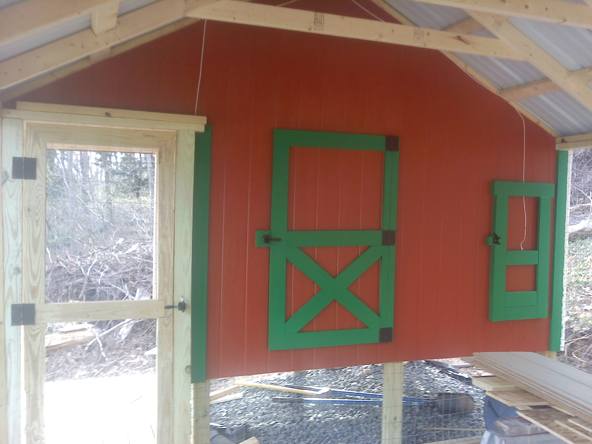 A look from inside the pen. The pen is covered with 2 x 4 screen with an overlay of chicken wire for the bottom half. To keep predators away, I am installing 2 strands of electric fence on the outside of the coop at 4 and 12 inches (5000 volts...OUCH).