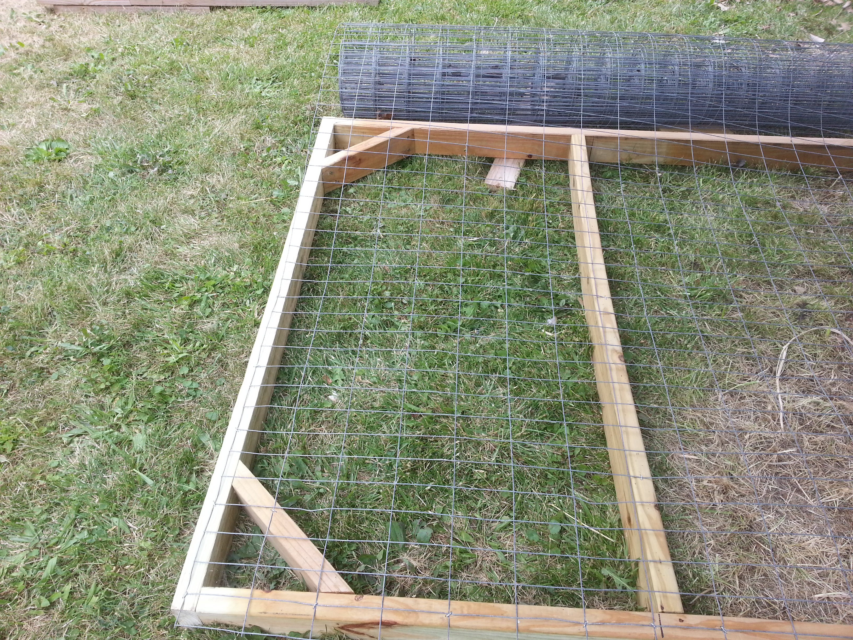 A panel getting the hardware cloth put on for the outside. The HC is wrapped around to the sides and bottom of the frame and the edges won't be accessible to prying hands