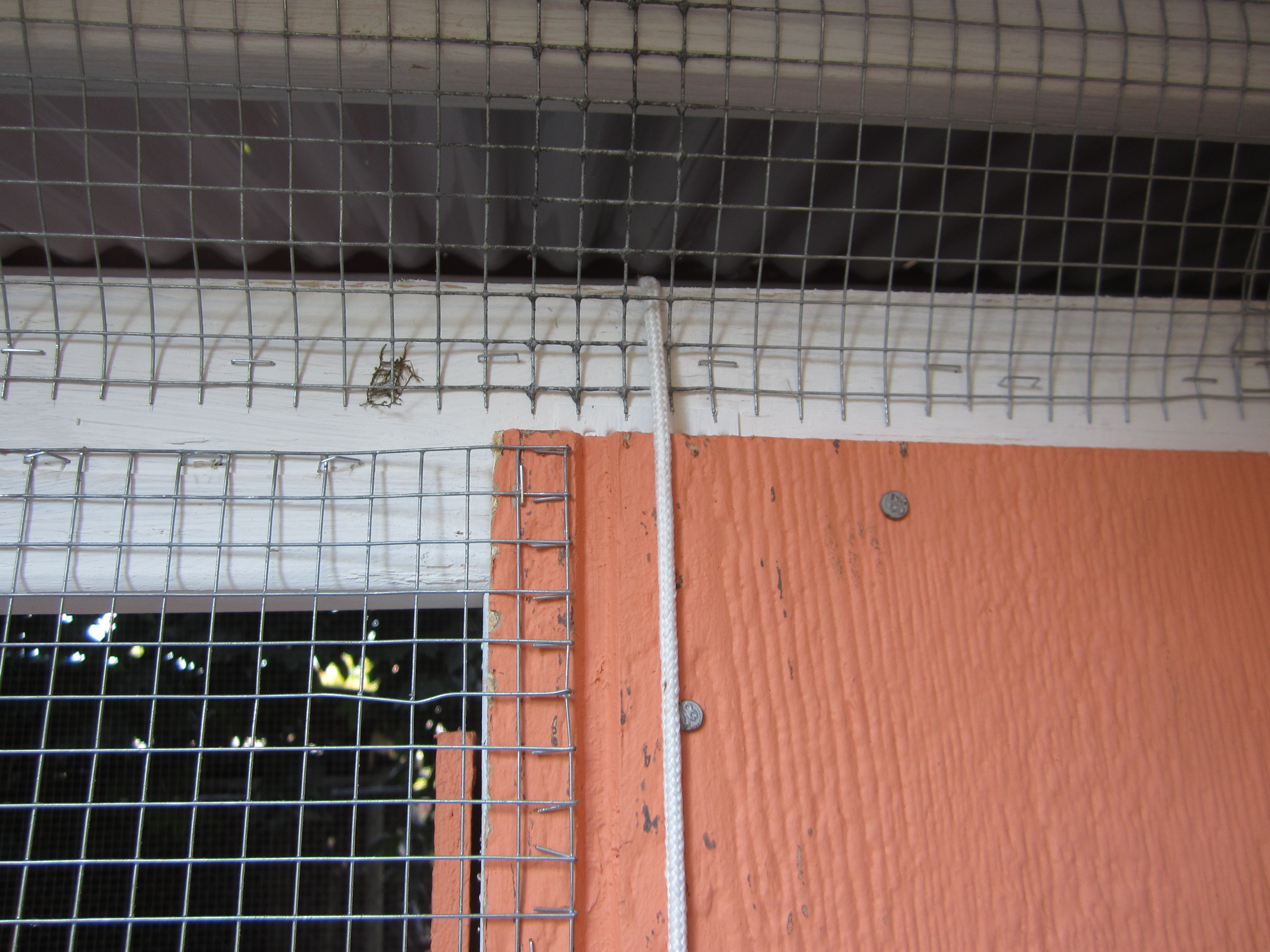 A pulley for the inside roost door that goes out into the coop, so we can open and close it from the outside