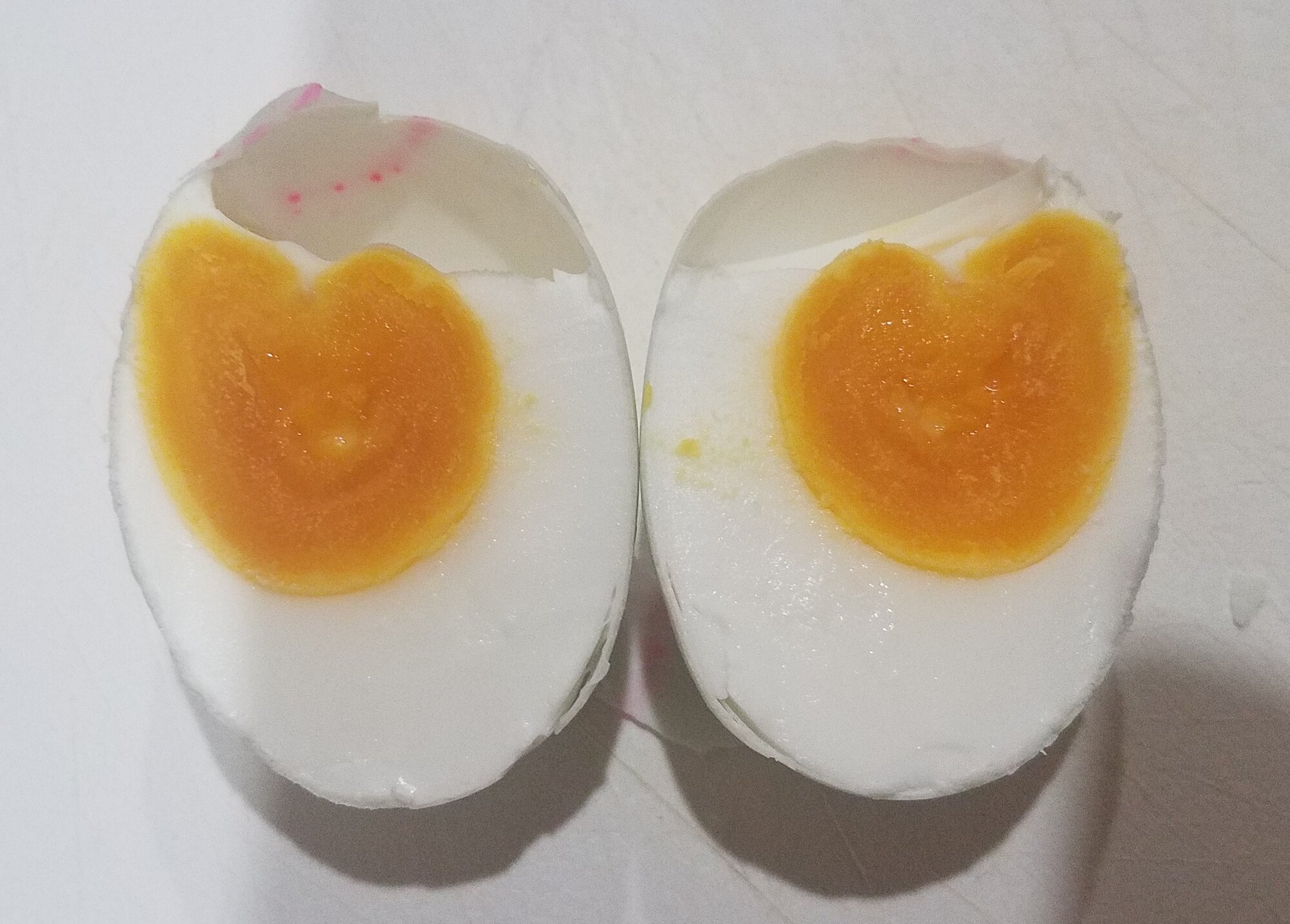 A salted duck Egg, after 24 days in concentrated brine. Picture with flash on.