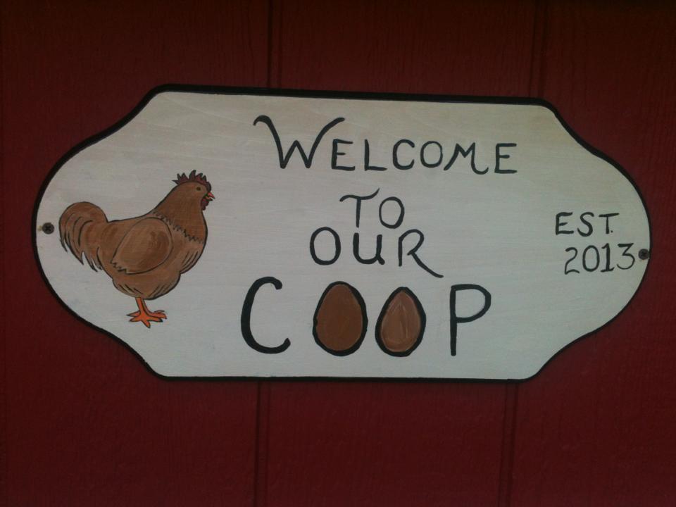 a sign i hand painted for the front of the coop