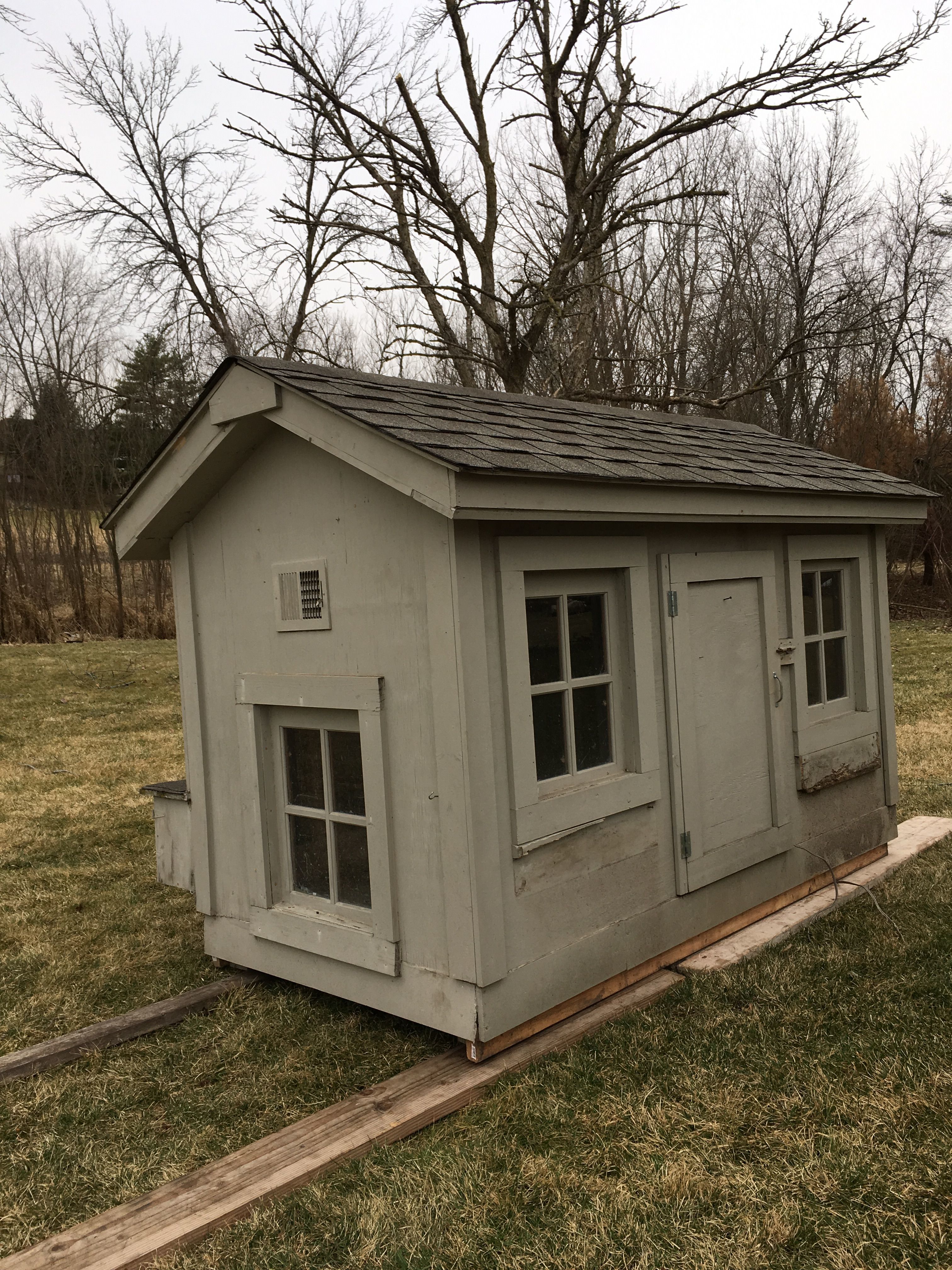 A used coop we received for free.  Inside dimensions are approximately 7.4' x 3.3'.  Inside height at eaves is 4' and at peak is 5'.  The front windows had flower window boxes that broke during the move.  They are inside the coop.  Coop was raised on 4x4 but hubby had to cut off legs in order to move it.