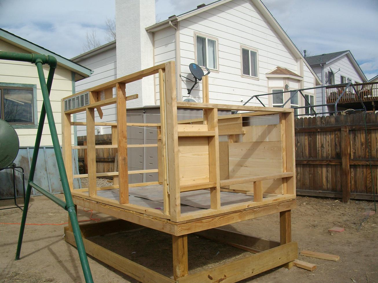 About half of the construction was done here and then the coop was moved up against the fence by sliding it on planks.
