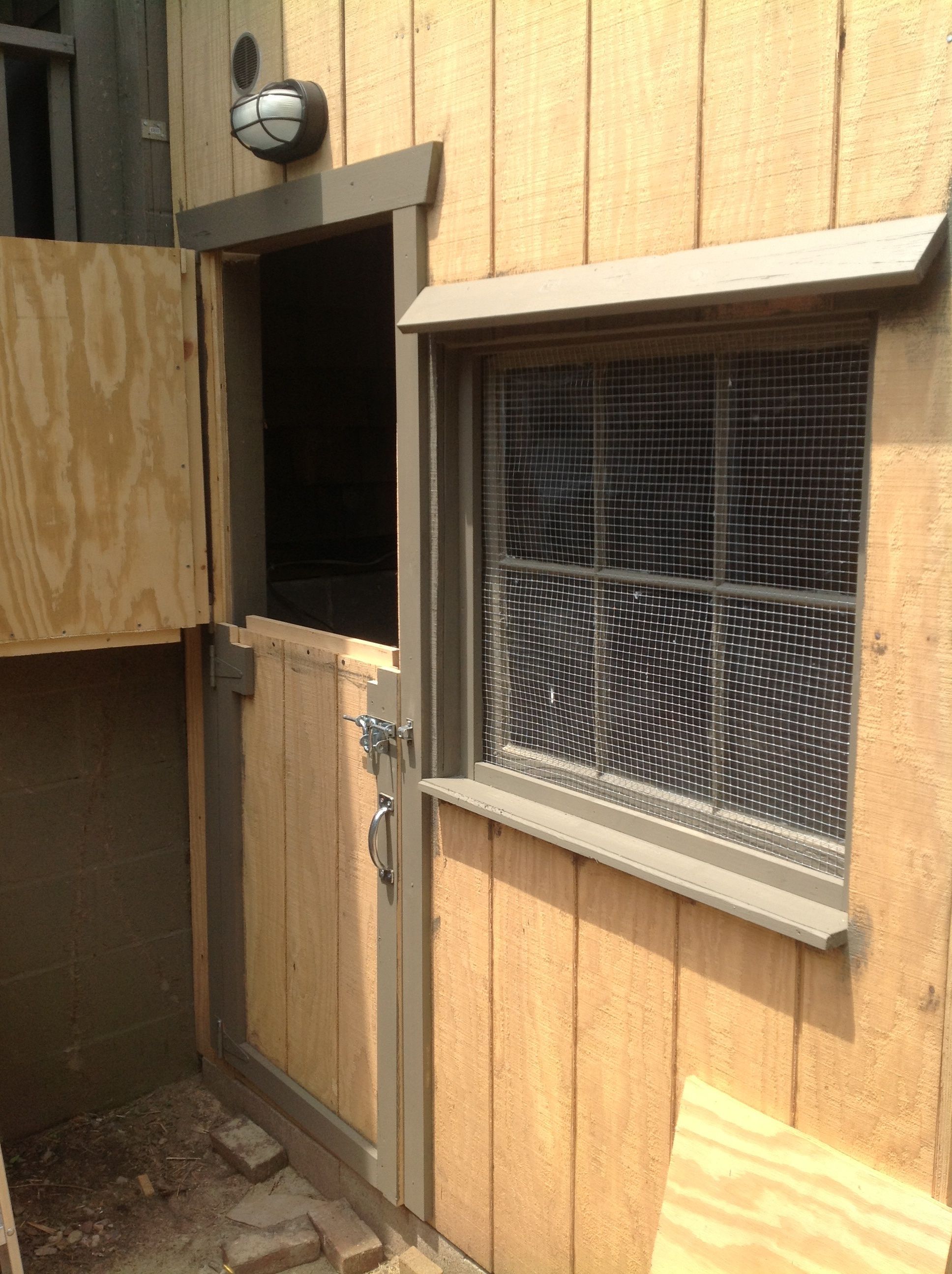 Access door and window.  Added screens 1/2" hardware cloth.  First window sill made from MDF failed first rain.  Used recycled board from original barn....believe it is petrified wood by now.  Held up after several stormes.