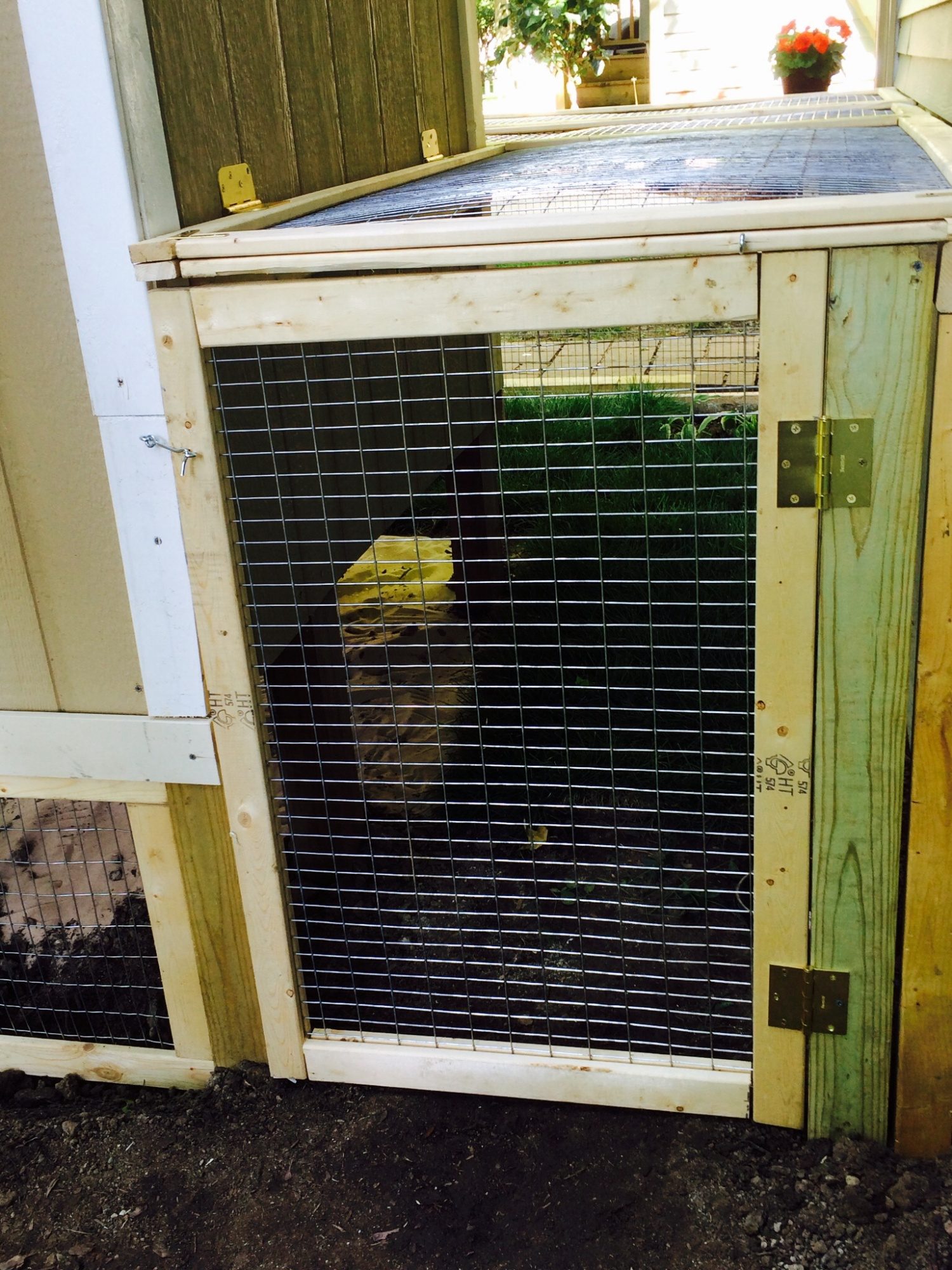 Access door to pen area.  Hinged to flip up while cleaning.