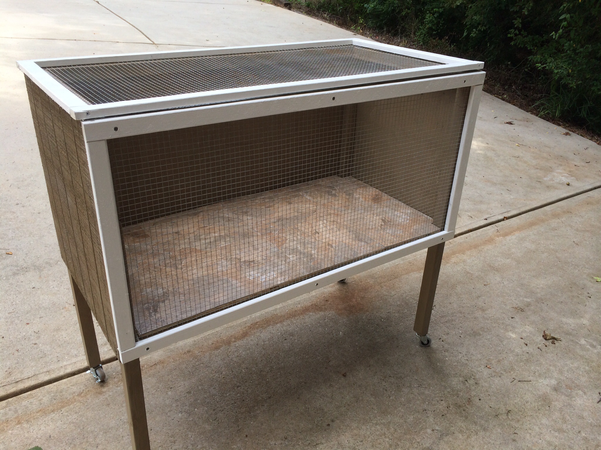 Added a top with hinges using hardware cloth and 1x2 strips.