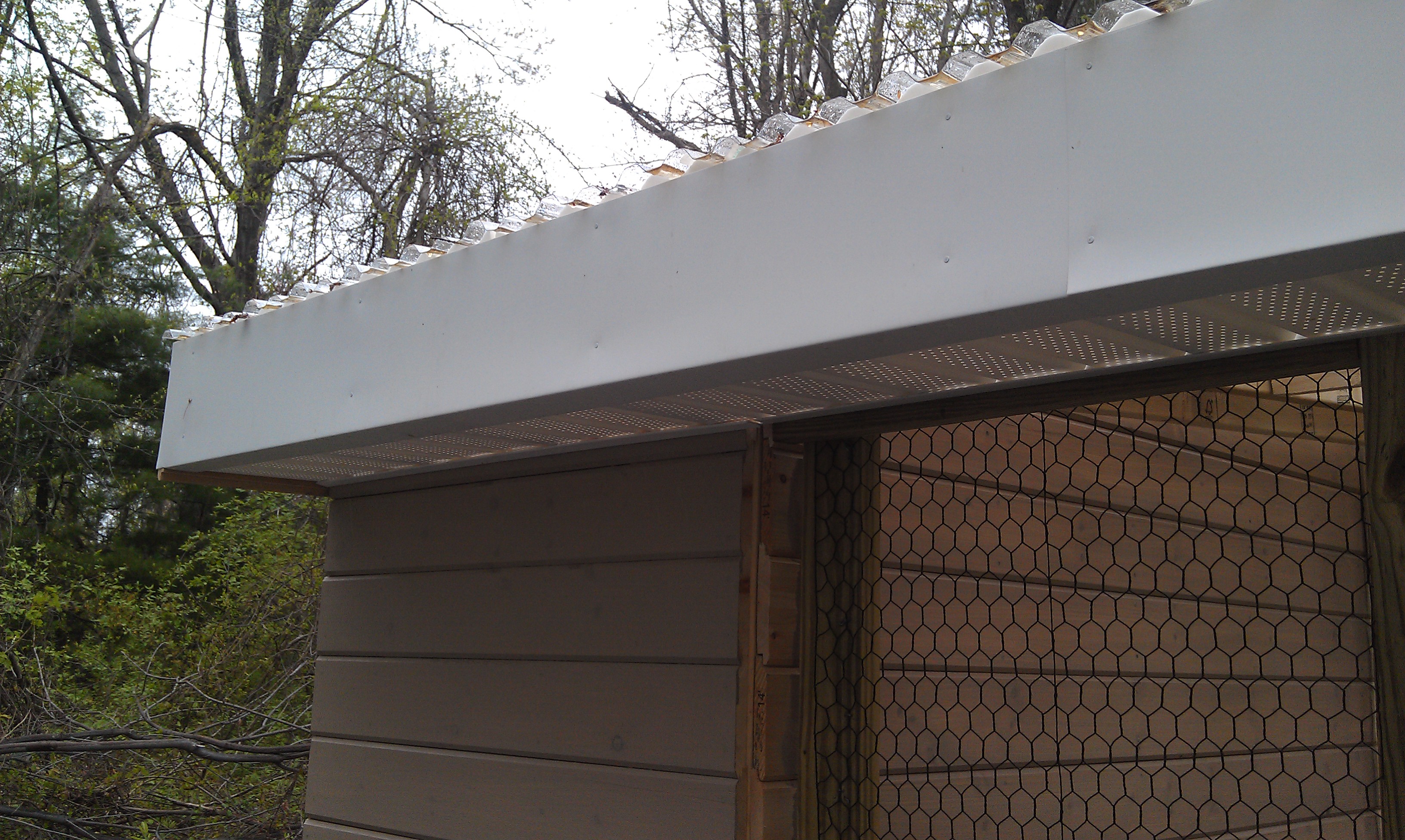 Added white metal around the top of the roof to keep out the birds. There is vented material underneath it.