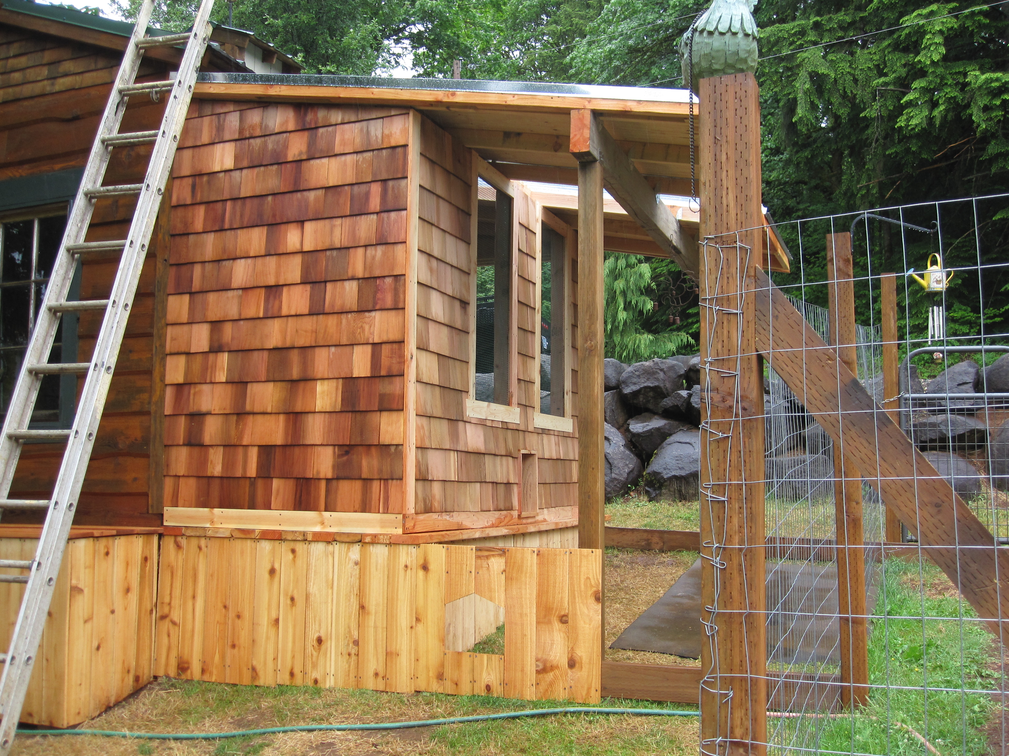 Adding a gutter, rain chain, and water barrel onto the corner.