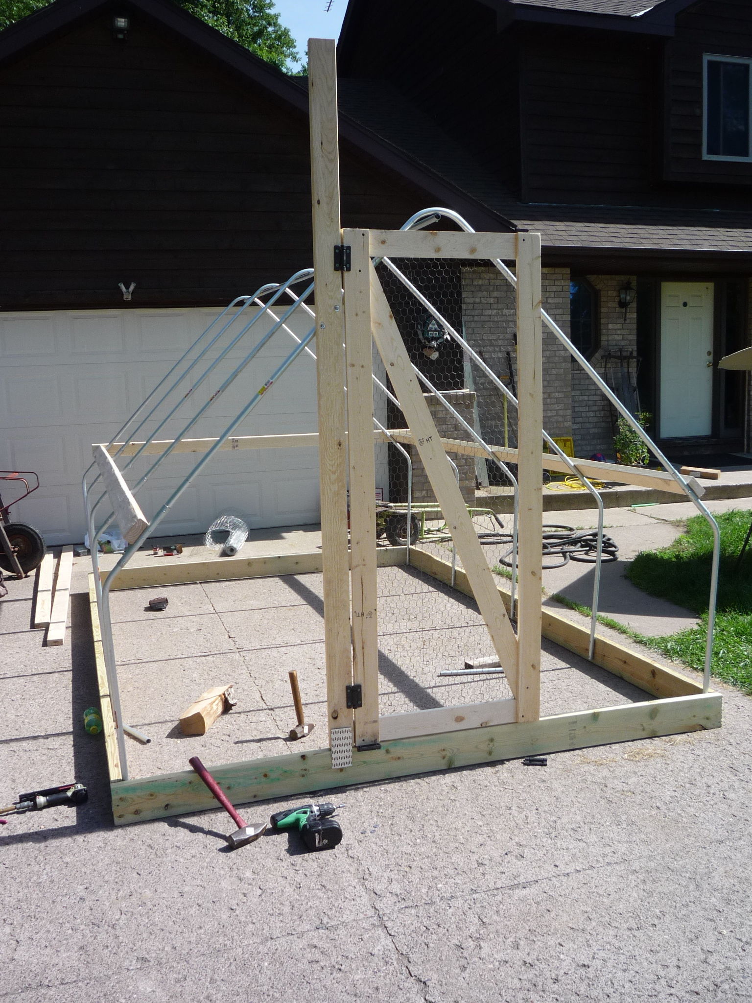 Adding the door. The door was built from 1"x4"s and Reell hinges.