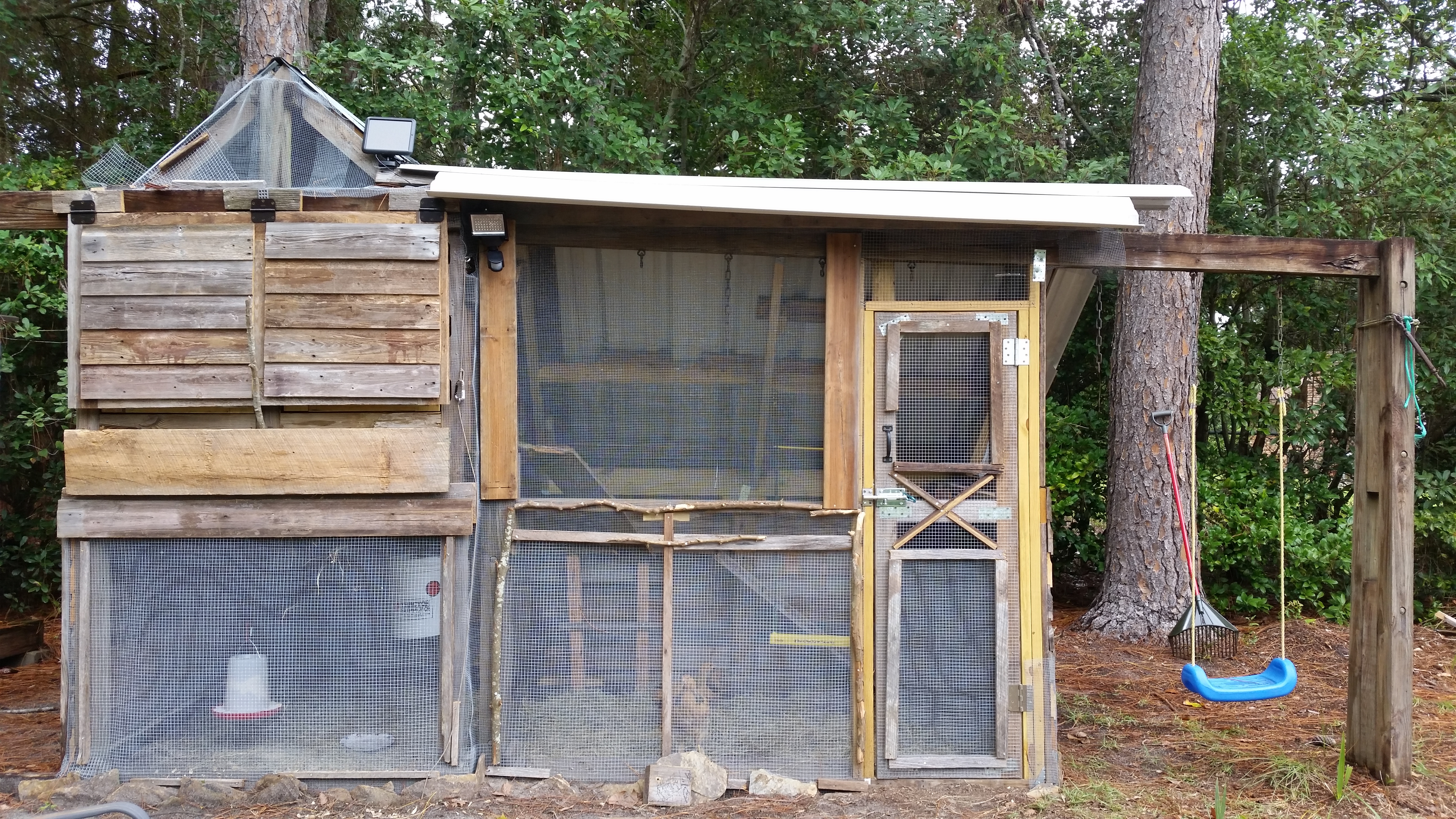 After: chicken coop w/run! (1/4" and 1/2" hardware cloth on all open parts, doubled up along bottom, trench around base has hardware cloth and slate lining them)