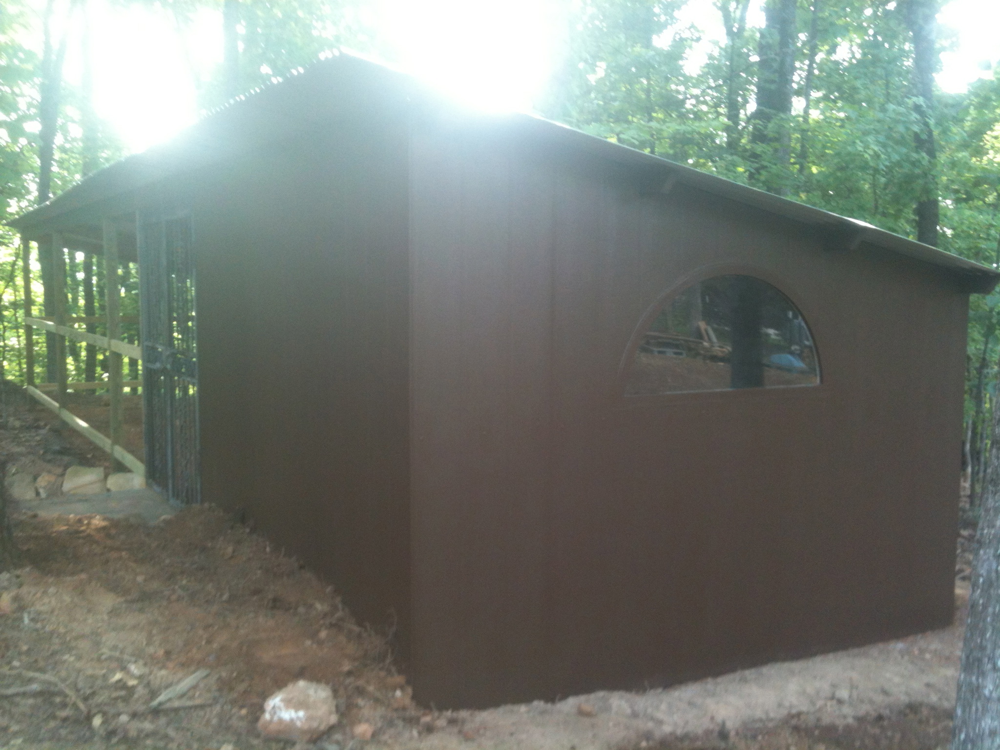 after laying and staking the wire next to the coop and covering it with rocks then back fill