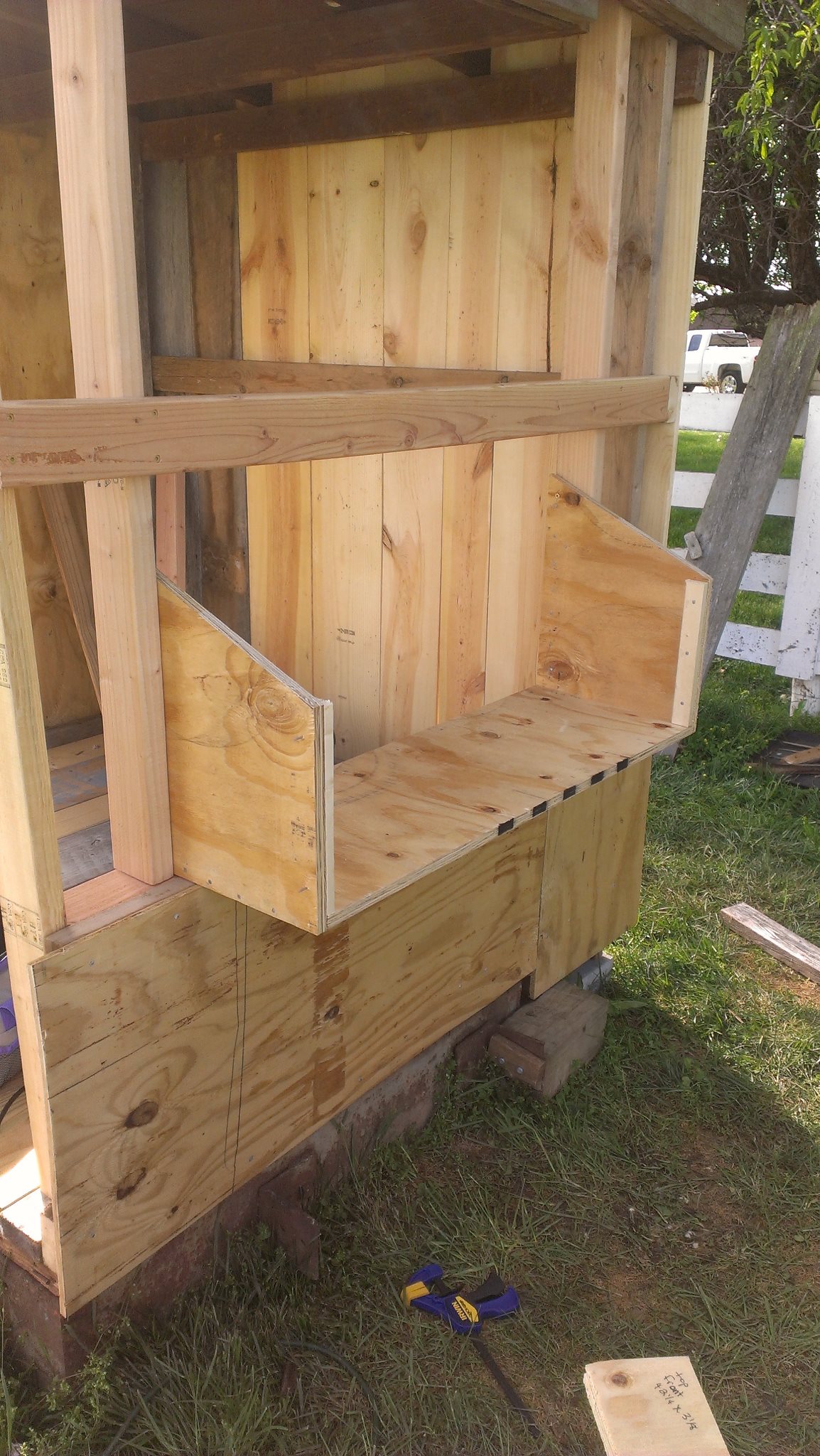 Another view of the nest box being built. I had to use very thick plywood because the plans call for the highest point of the sides to be 18". After four straight days of rain, I noticed one end of the access panel door has swollen and I will be replacing it with a piece of wood. since the height is just a little over 8". I will also be replacing the narrow strip above the access panel with wood.