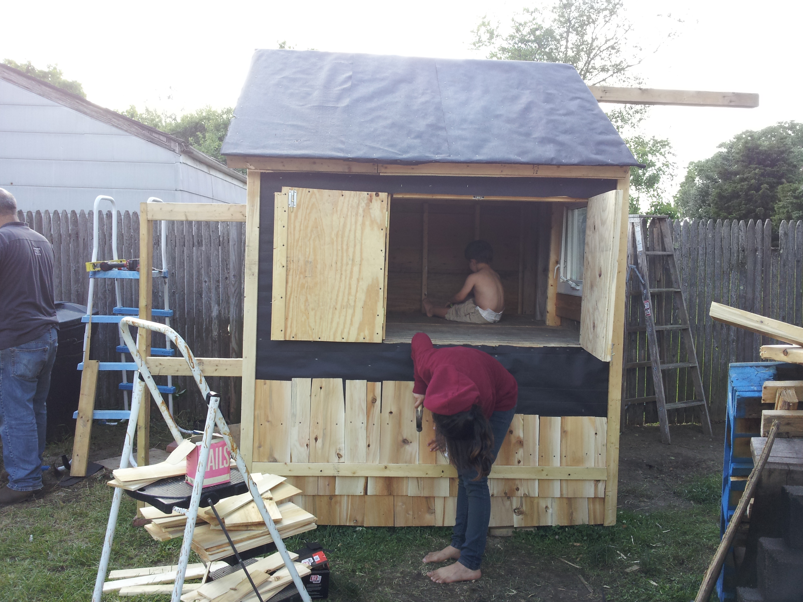Another view, with hub in the corner working on the bump out that is the access to our small shed storage area.  Post coming off roof area to the side will be extended to be a full covered run.