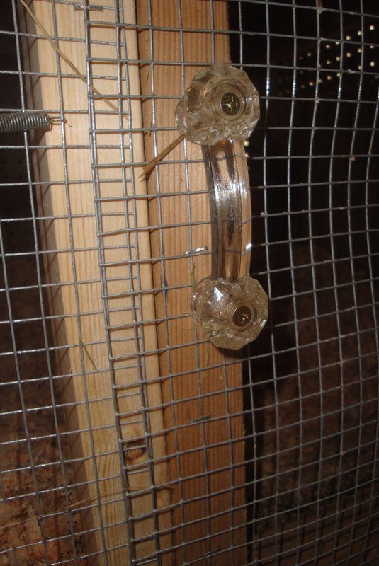 Antique glass draw pulls for cabinet handles.