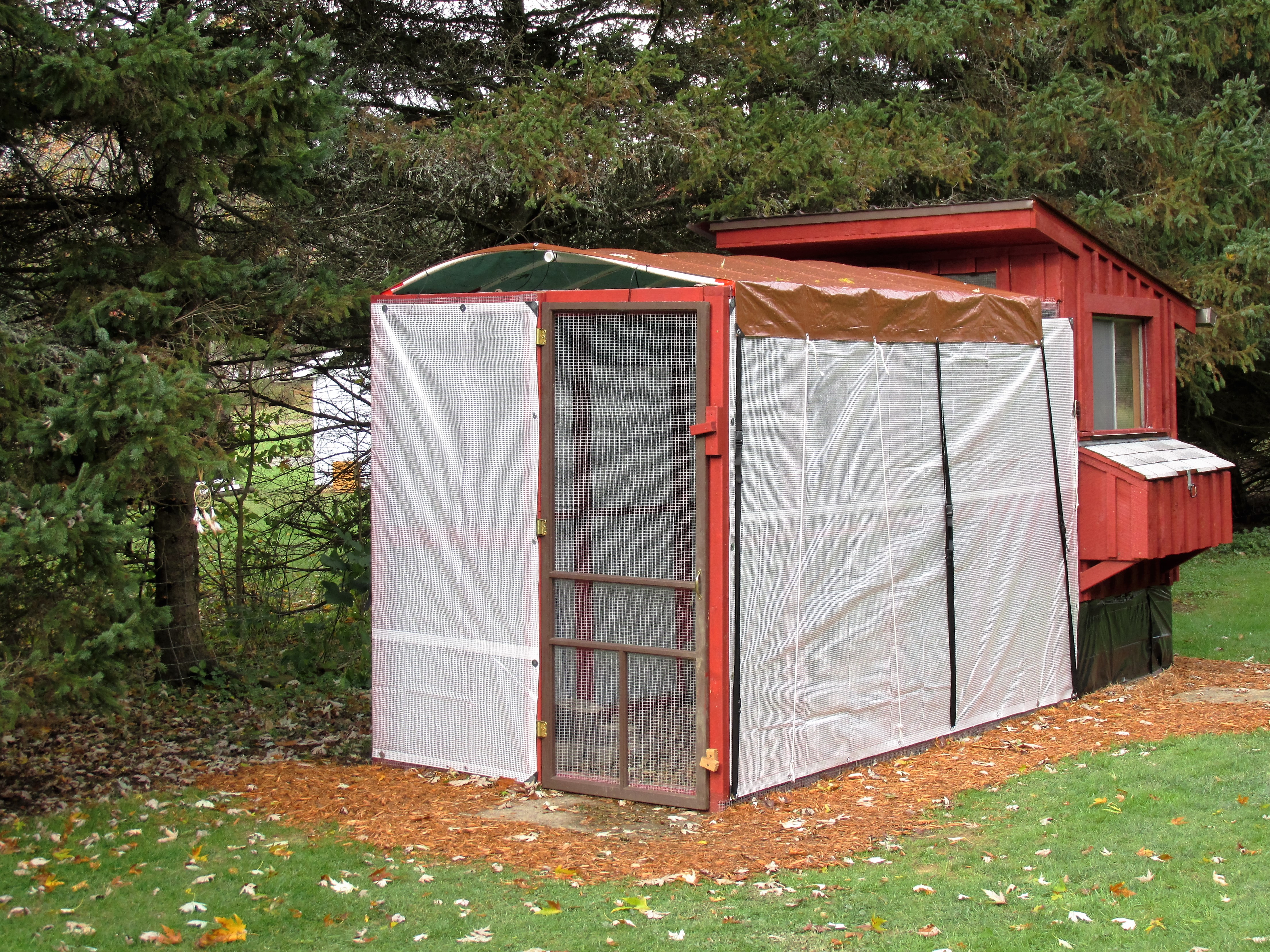 arched tarp roof and covered sides for winter, I plan on install a metal roof over the run this coming spring
