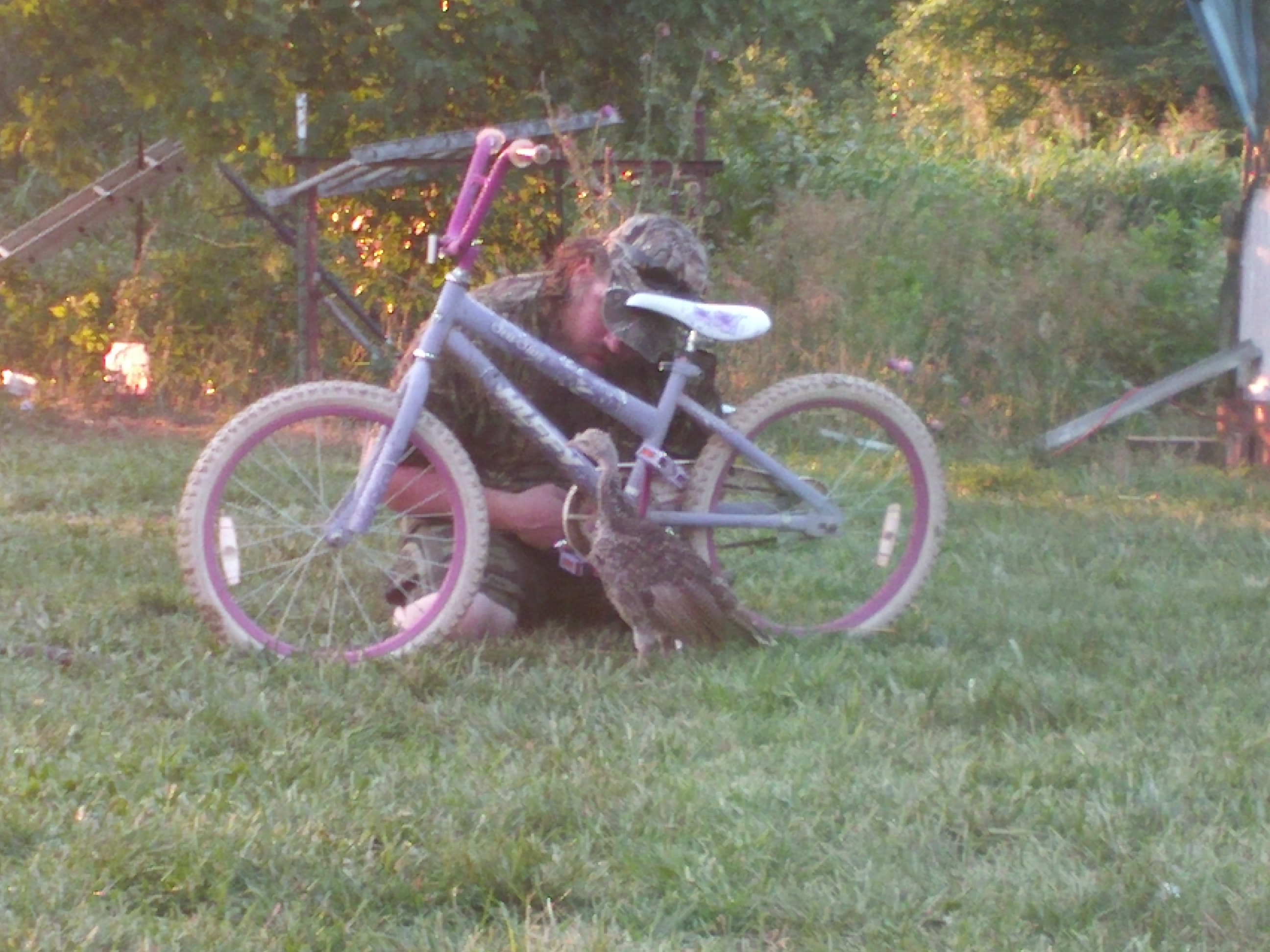 Ares helping daddy fix a bike