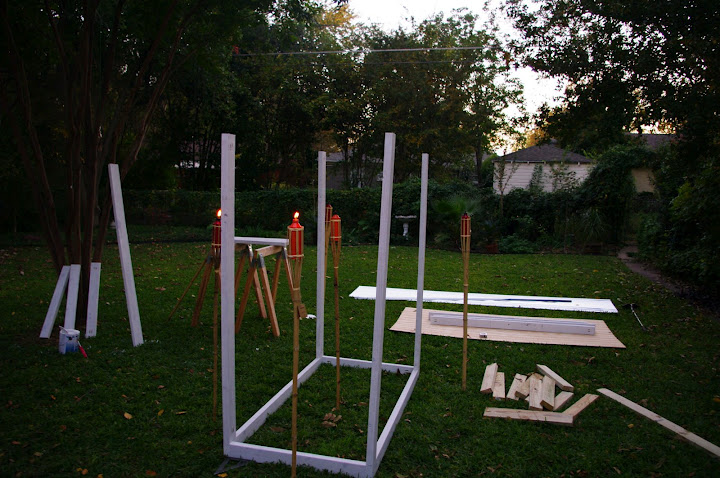 Assembling the coop. We had to get the tiki torches out to fend off the mosquitoes.