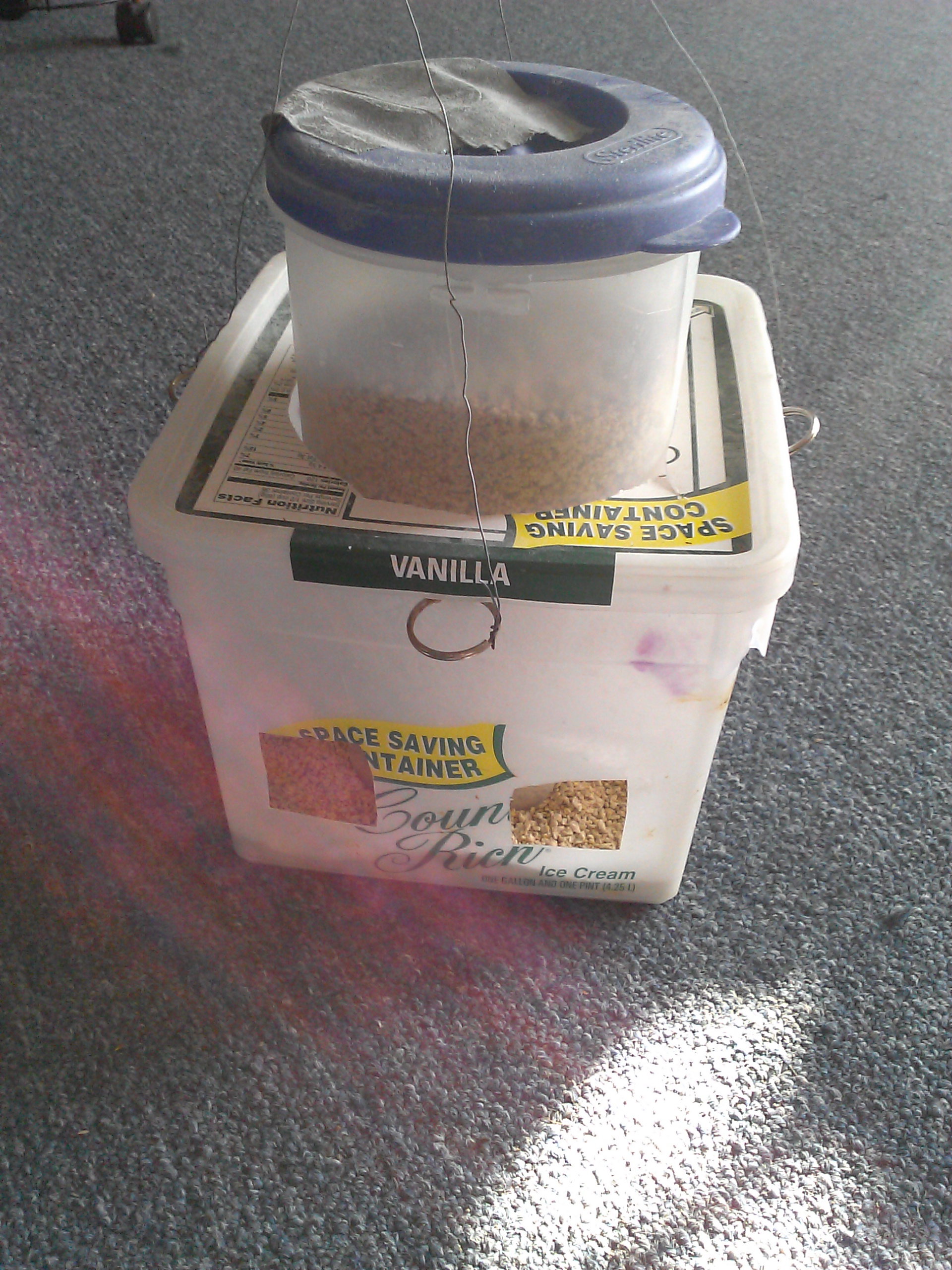 Attach wires to key rings to form hangers. TA-DA!! Chicks can't waste feed!