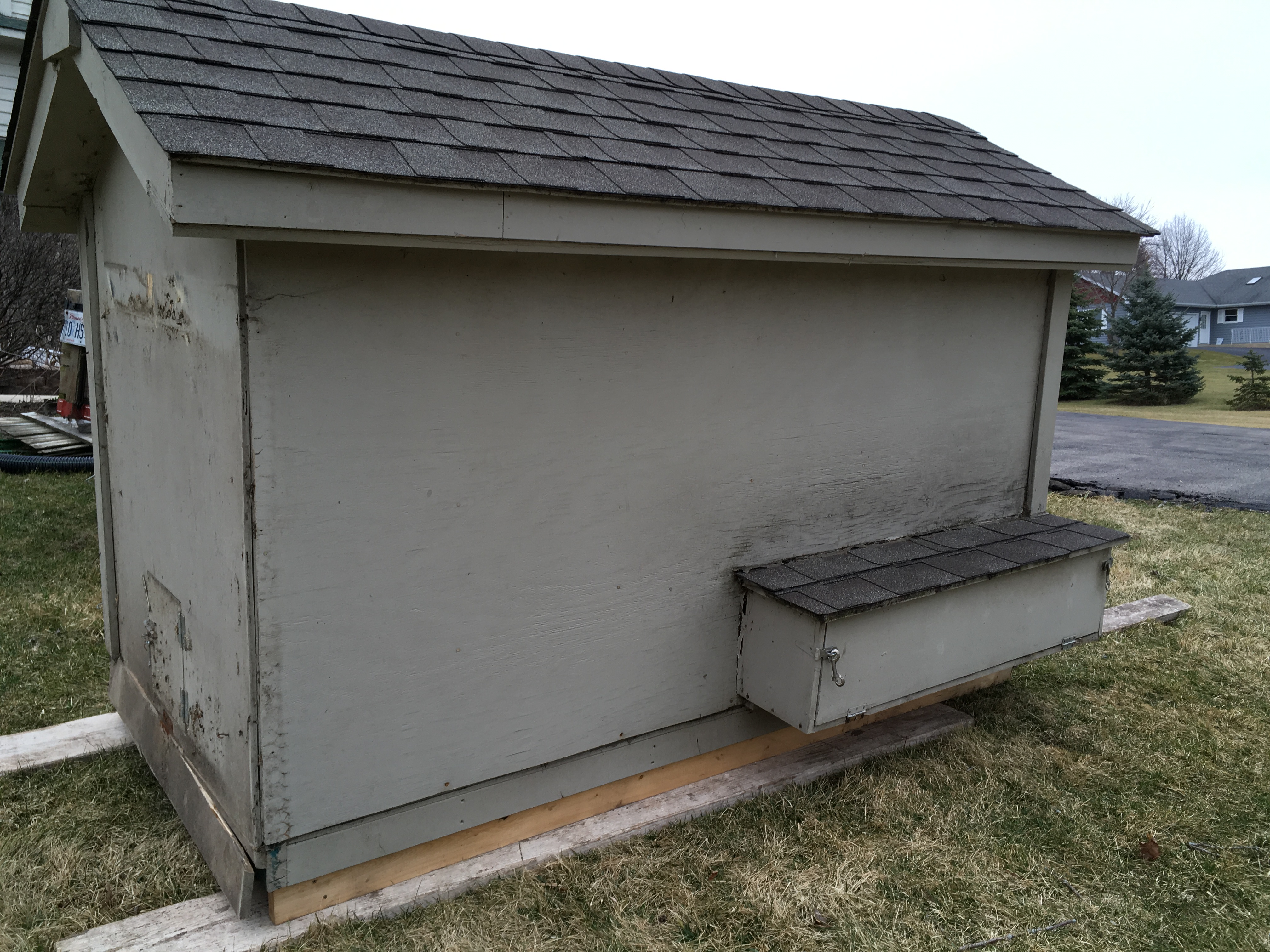 Back side.  The nesting boxes are pulling away from wall, and there's water damage.  My husband will try to reattach and caulk to see if we can prevent further water entry. Otherwise, we may need to rebuild them.