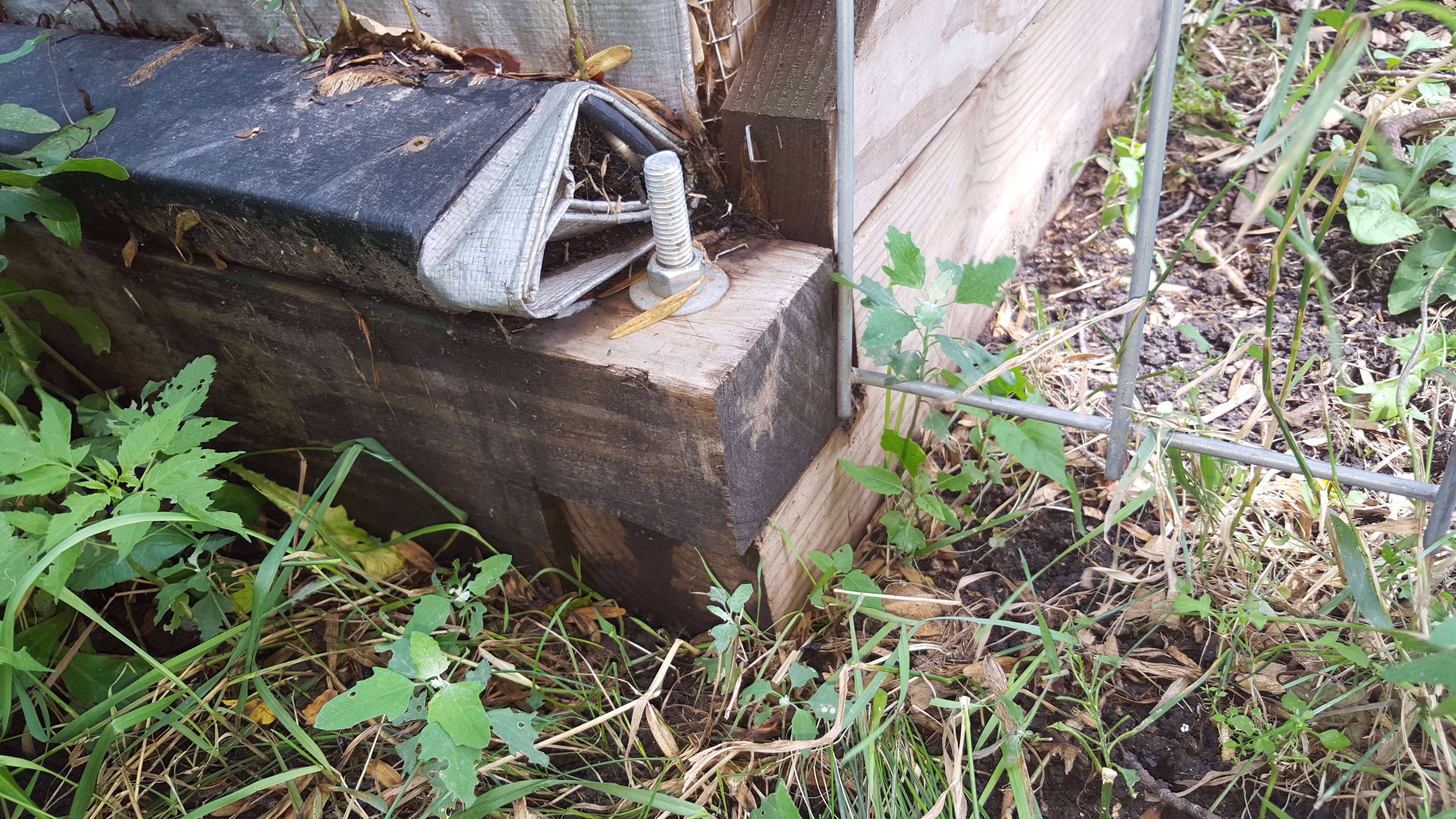 base lap joint and bolt

tarp wrapped around 2 x 4 and screwed down