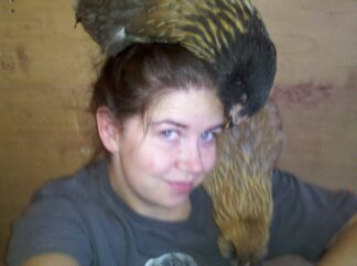 Biscuit is on my head and Friday is on my shoulder.