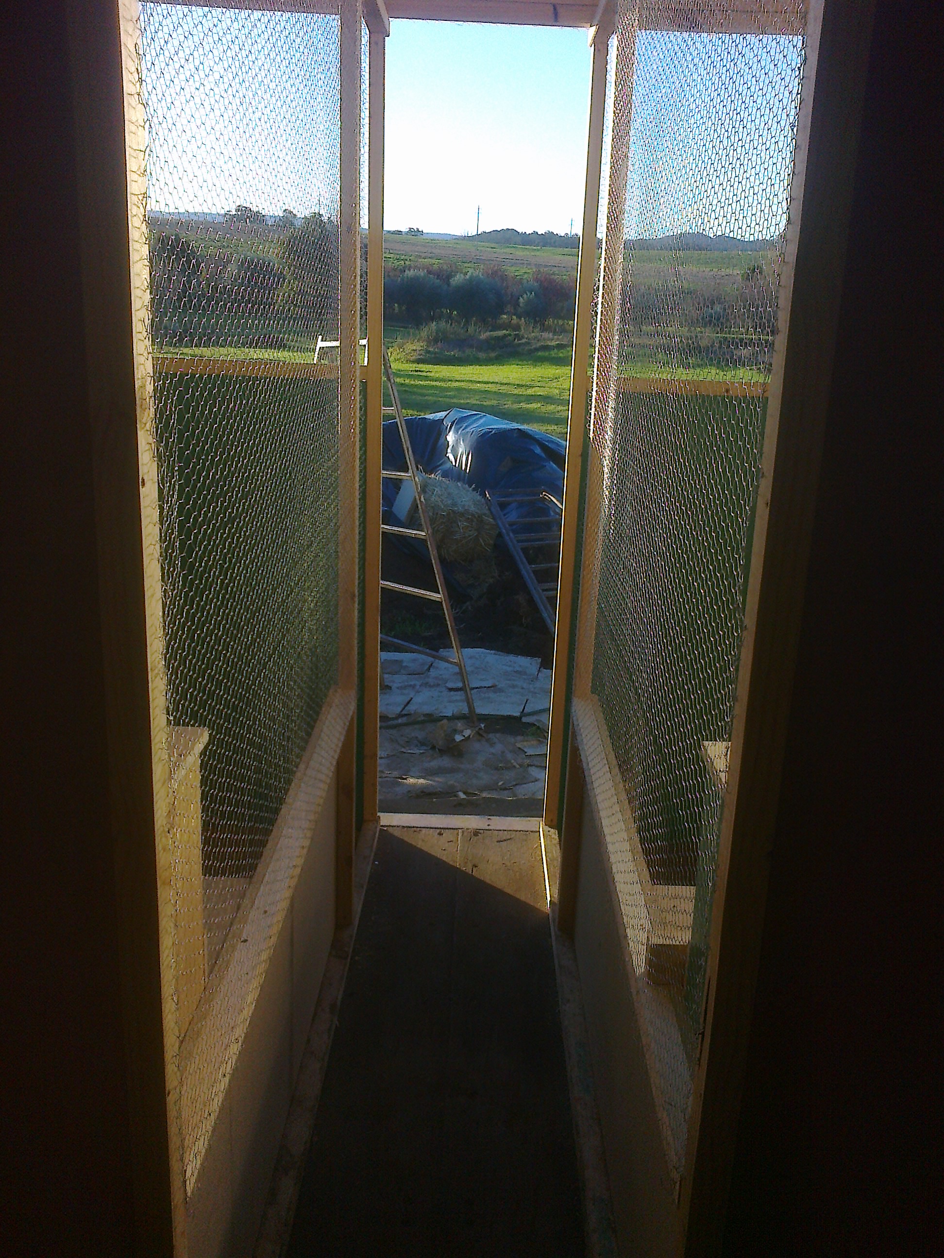 bottom 0.6m of the coop are plywood .