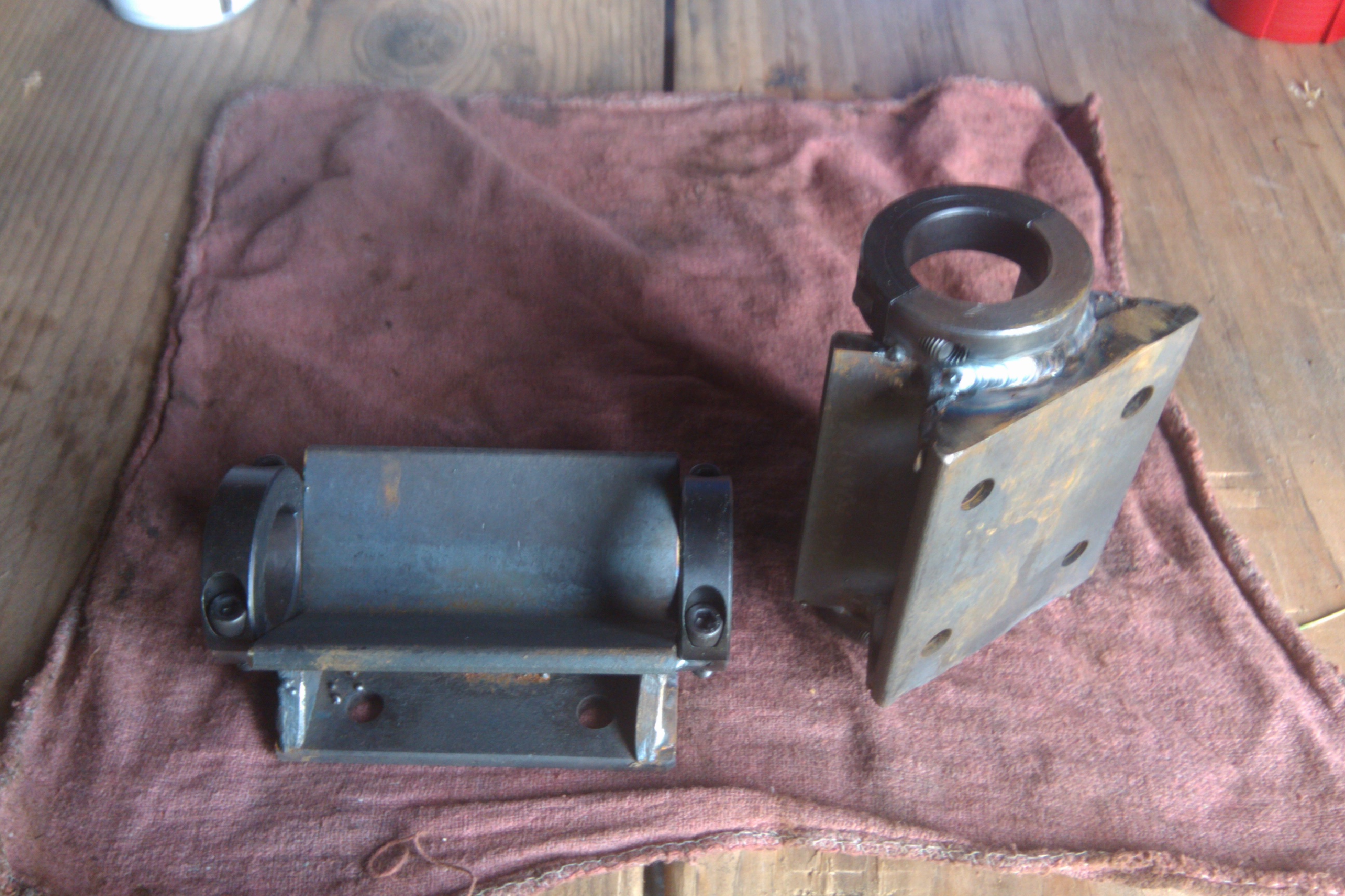 Brackets to point the hiller discs to the frame.  1/4x2 HR angle, with 1 1/4 friction clamp welded on top